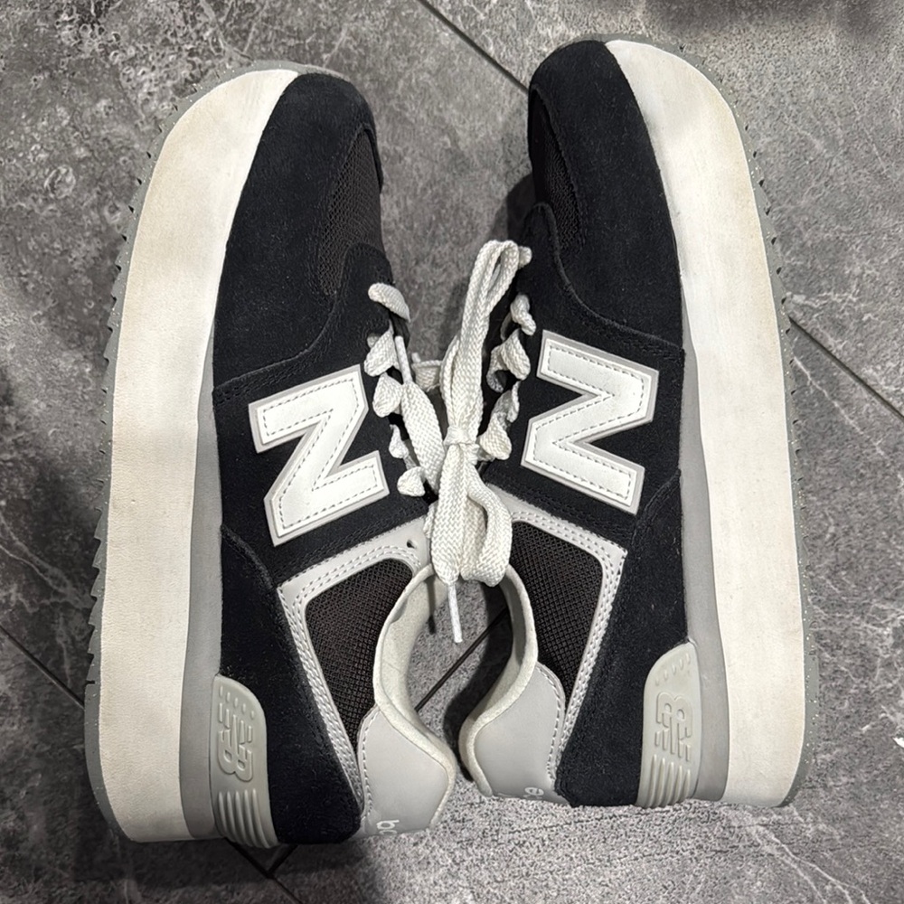 New Balance women’s Black and White 574 platform Sneakers